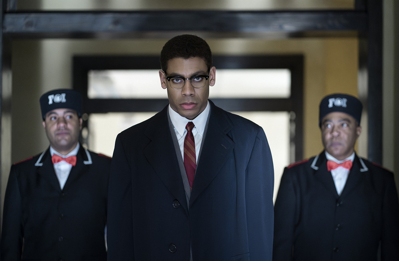 Malcolm X, played by Aaron Pierre, is escorted from Temple in "Genius: MLK/X." (National Geographic/Richard DuCree)