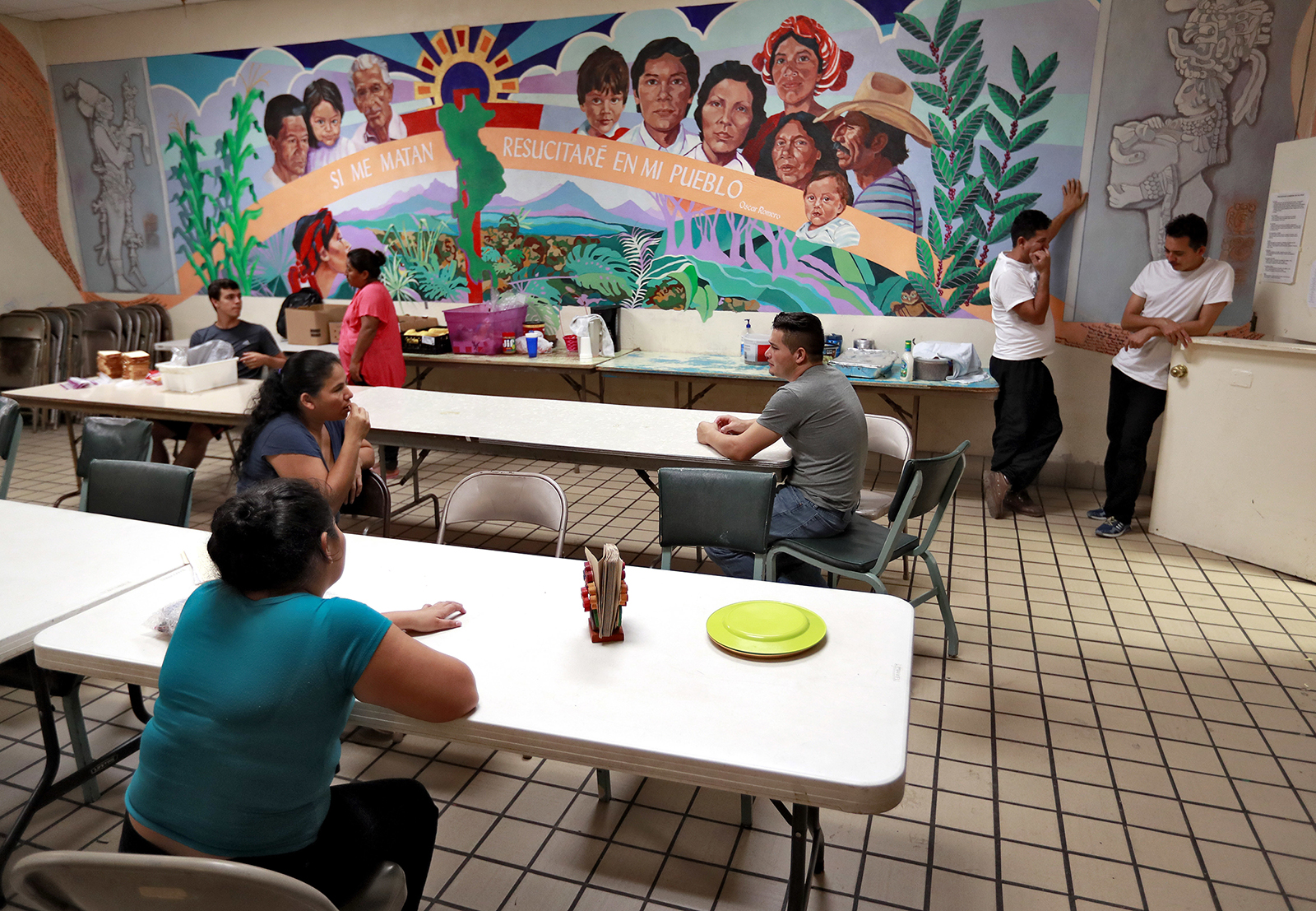 Migrant parents talk at the Annunciation House, June 26, 2018, in El Paso, Texas. (AP Photo/Matt York)