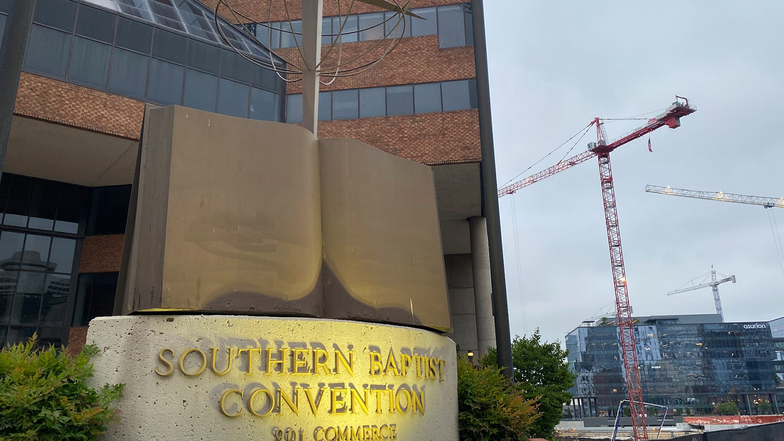 A cross and Bible sculpture stand outside the Southern Baptist Convention headquarters in Nashville, Tennessee.