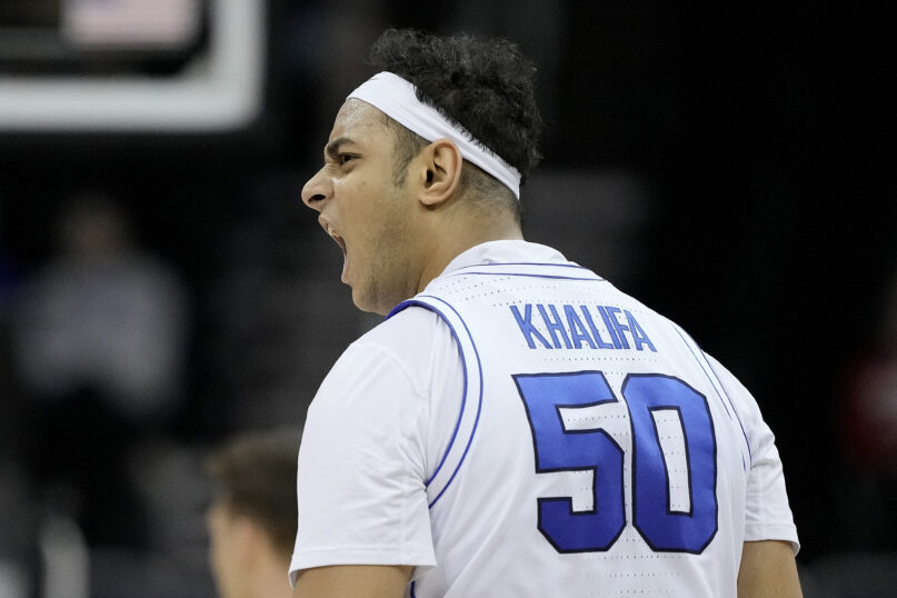 BYU center Aly Khalifa celebrates after making a basket during the first half of an NCAA college basketball game against UCF Wednesday, March 13, 2024, in Kansas City, Mo. (AP Photo/Charlie Riedel)