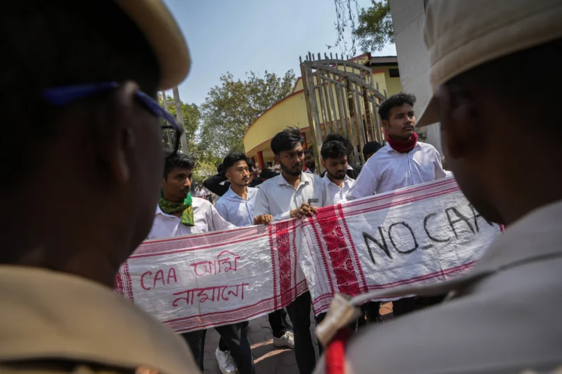 Students protest against the Citizenship Amendment Act (CAA) in Guwahati, India, Tuesday, March 12, 2024. Banner in Assamese reads, “we will not accept CAA” (AP Photo/Anupam Nath)