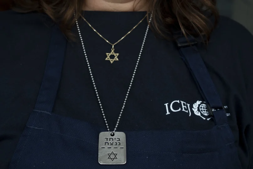 Elisabeth Odegaard poses for a portrait with necklaces as she prepares food for Israeli soldiers on a brief respite from combat operations in the Gaza Strip, in Tel Aviv, Wednesday, March 6, 2024. (AP Photo/Maya Alleruzzo)