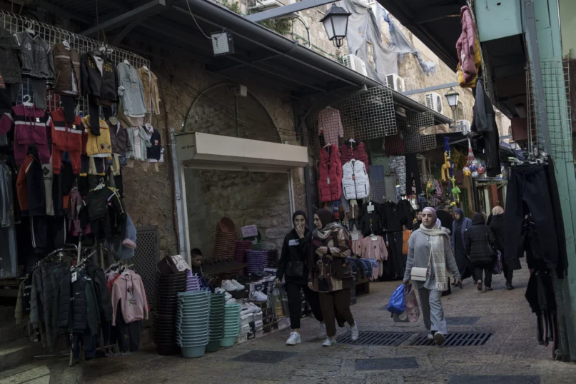 Muslim women walk through a market, ahead of the holy Islamic month of Ramadan, in the Old City of Jerusalem, Thursday, March 7, 2024. (AP Photo/Leo Correa, File)