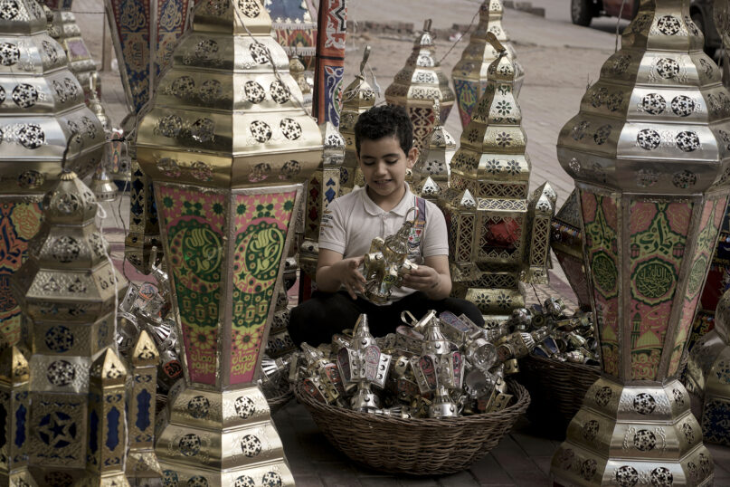 A boy looks at traditional lanterns ahead of the upcoming Muslim fasting month of Ramadan, in Cairo, Egypt, Thursday, March 7, 2024. Muslims throughout the world are preparing to celebrate Ramadan, the holiest month in the Islamic calendar, refraining from eating, drinking, smoking and sex from sunrise to sunset. (AP Photo/Amr Nabil)