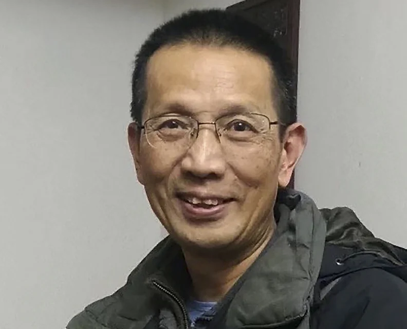 In this UGC photo taken March 5, 2024 and released by Car Family, Rev. John Sanqiang Cao poses for a photo a day after his release from prison in Changsha in southern Hunan province. (Cao Family via AP)