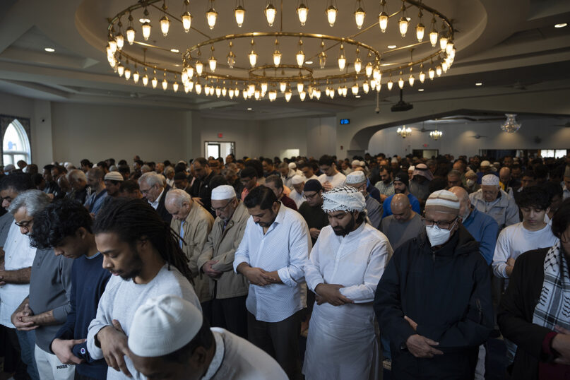 Muslim community members gather for the jumah, a special noon service on Fridays that observant Muslims are obliged to attend, March 15, 2024, at the Islamic Society of Central Jersey in Monmouth Junction, N.J. (AP Photo/John Minchillo)