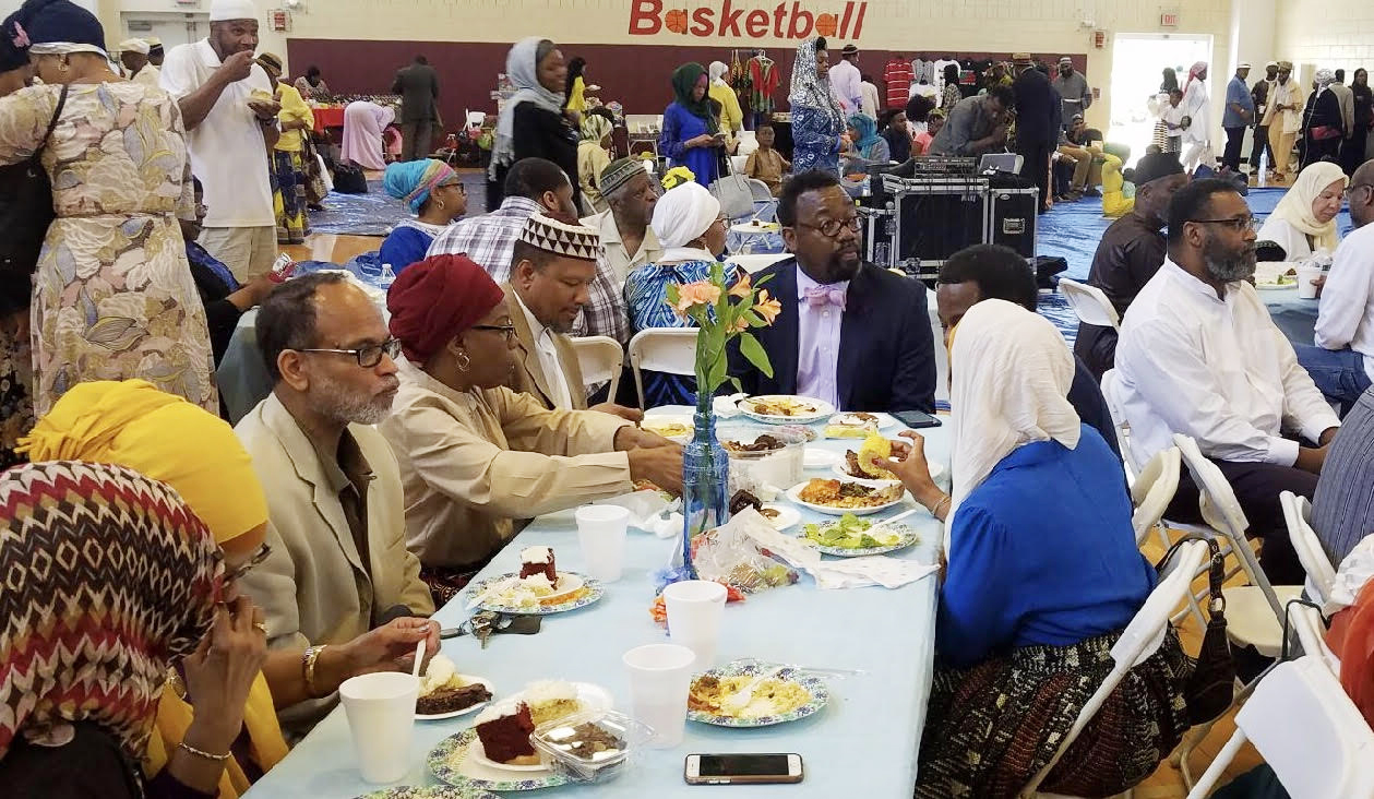 June 27, 2017, Rev. Thomas Bowen, head of table, attends Masjid Muhammad’s Eid Celebration at Trinidad Recreation Center. Photo by Albert Sabir, courtesy The Nation's Mosque