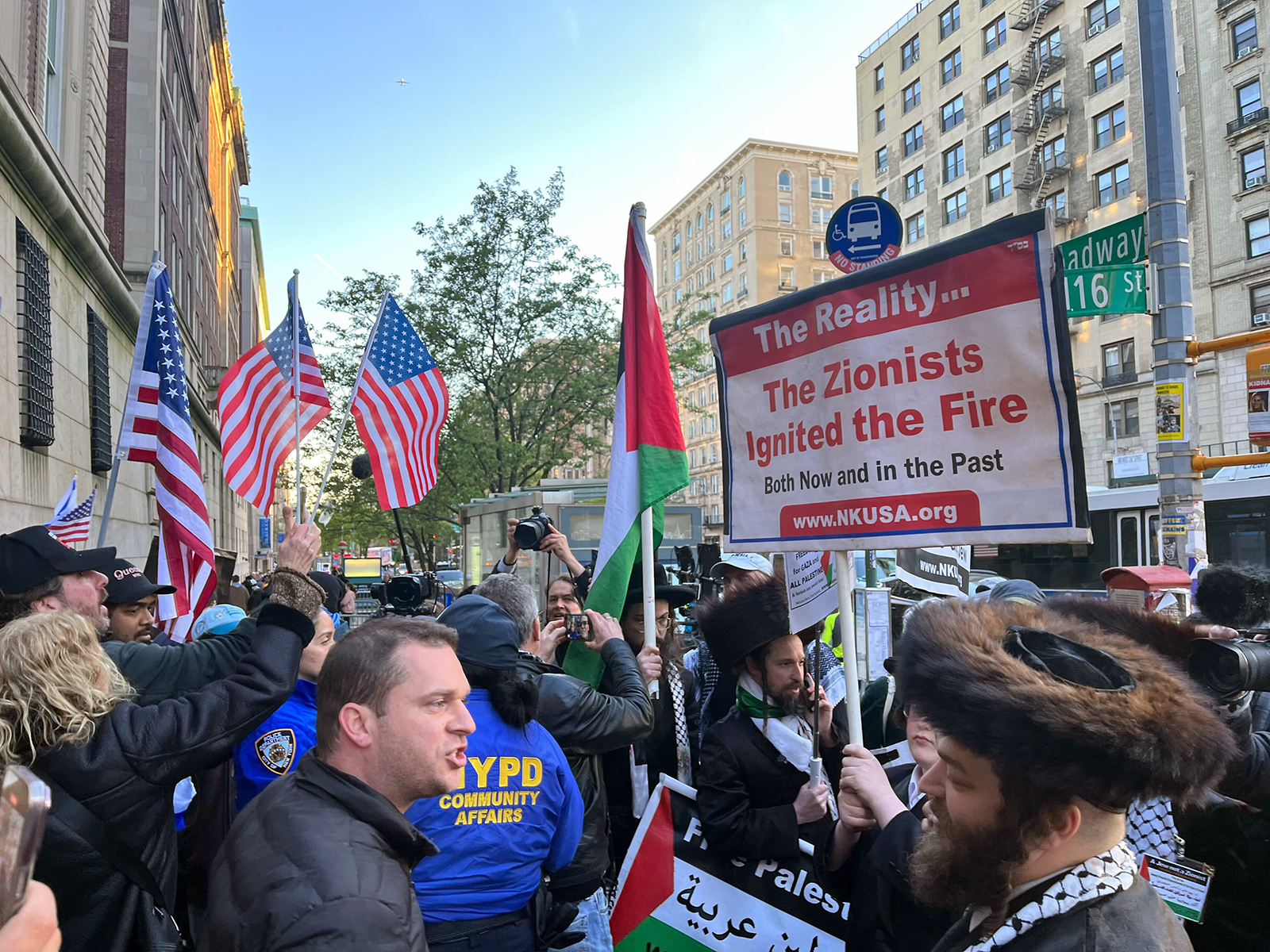 “United for Israel” marchers, left, interact with members of the anti-Zionist Hassidic group Neiturei Karta, right, near Columbia University, Thursday, April 25, 2024, in Manhattan, New York. (RNS photo/Fiona André)