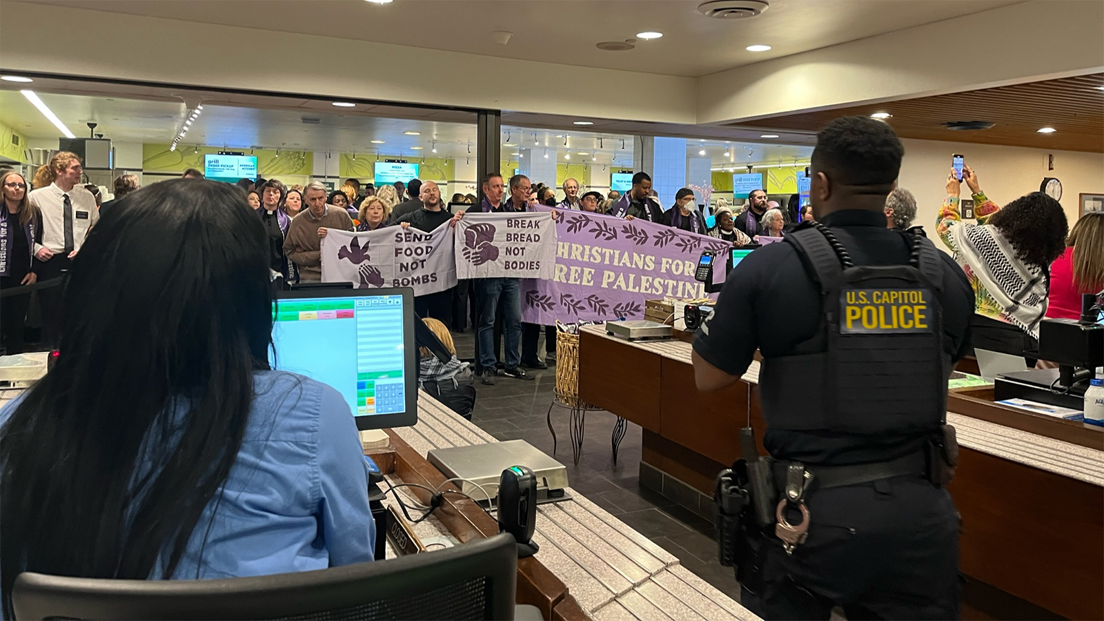 U.S. Capitol Police arrive to arrest demonstrators during a Christians for a Free Palestine protest in the U.S. Senate cafeteria, Tuesday, April 9, 2024, at the Capitol in Washington. (RNS photo/Aleja Hertzler-McCain)
