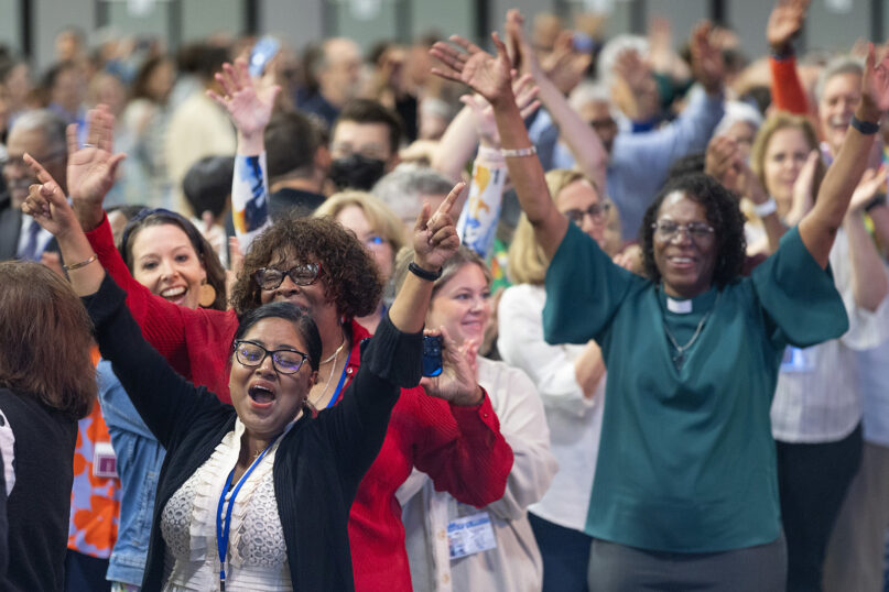 Delegates, visitors and staff of the 2024 United Methodist General Conference in Charlotte, N.C., dance in the aisles following morning worship on the final day of the conference, Friday, May 3, 2024. (Photo by Mike DuBose, UM News)