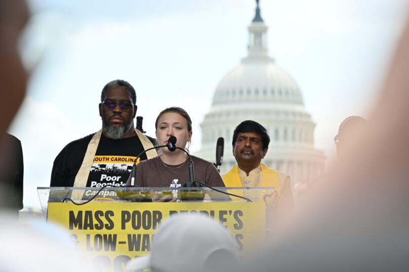 Gabriela Martinez, Associate of Campaigns for Franciscan Action Network, addresses a crowd at a demonstration organized by the Poor People's Campaign outside the U.S. Capitol on June 29, 2024.