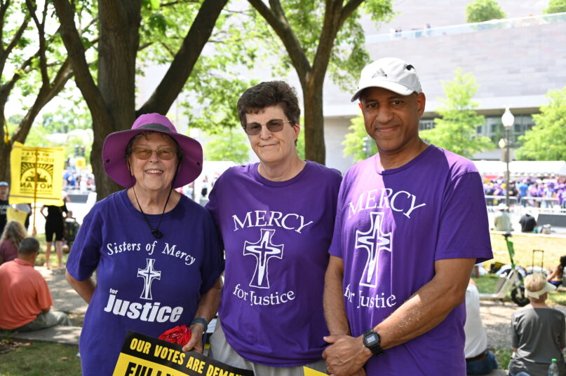 Mary Pendergast, Terri Bednarz, and Lamar Bailey, advocates with the Sisters of Mercy, attend a Poor People's Campaign event outside the U.S. Capitol on June 29, 2024.