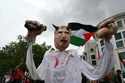 Demonstrators manipulate a large puppet representing Benjamin Netanyahu while marching near the National Mall, Wednesday, July 24, 2024, in Washington. (RNS photo/Jack Jenkins)