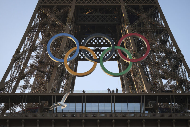 FILE - The Olympic rings are mounted on the Eiffel Tower, Friday, June 7, 2024 in Paris. (AP Photo//Thomas Padilla, File)