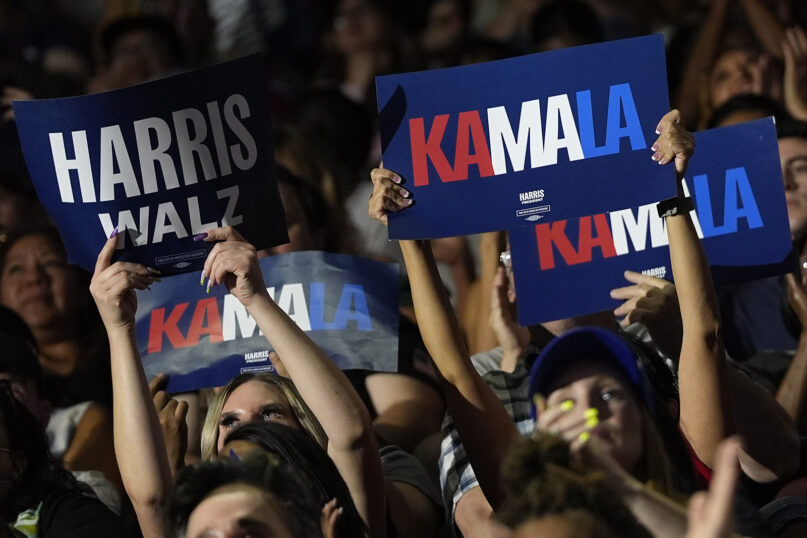 Supporters display signs in the audience before Democratic presidential nominee Vice President Kamala Harris speaks at a campaign rally, Aug. 10, 2024, in Las Vegas. (AP Photo/Julia Nikhinson)