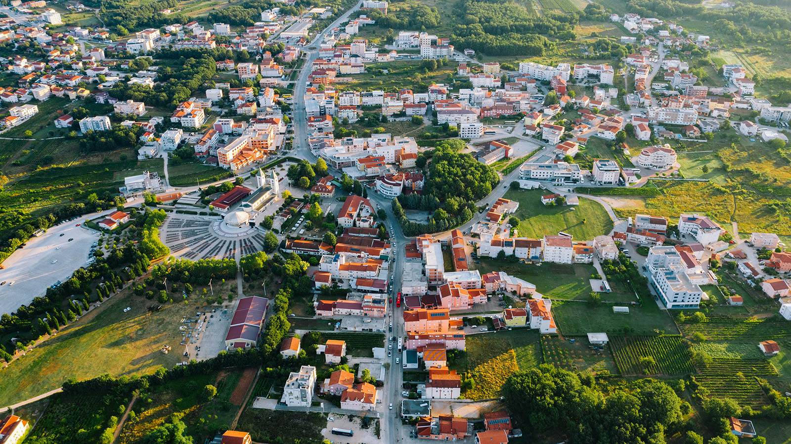 Aerial view of Medjugorje, Bosnia-Herzegovina, with pilgrimage site St. James Church at center left. (Photo by Jeswin Thomas/Unsplash/Creative Commons)