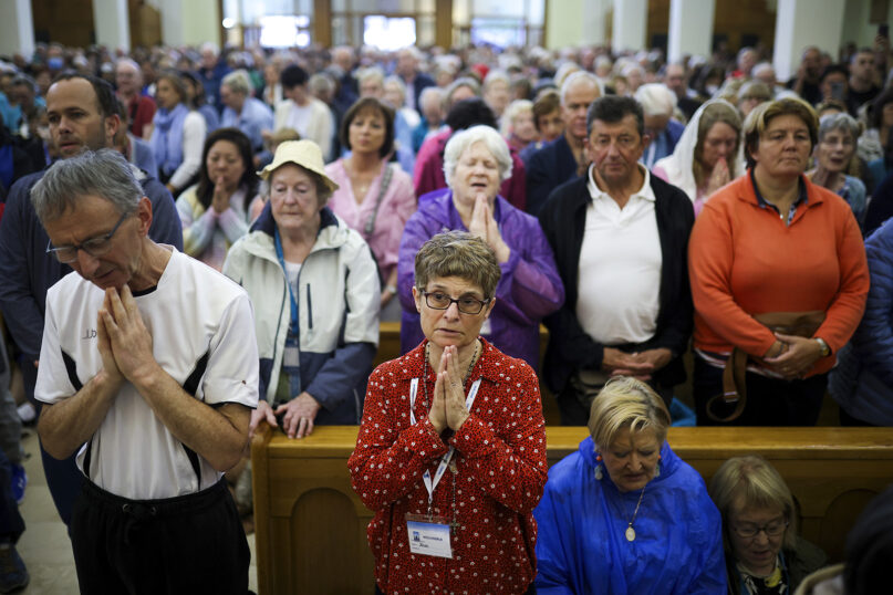 Pilgrims pray inside St. James Church in Medjugorje, Bosnia-Herzegovina, Sept. 19, 2024. (AP Photo/Armin Durgut)