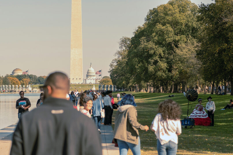 People walk along the National Mall in Washington. (Photo by Samuel Girven/Unsplash/Creative Commons)