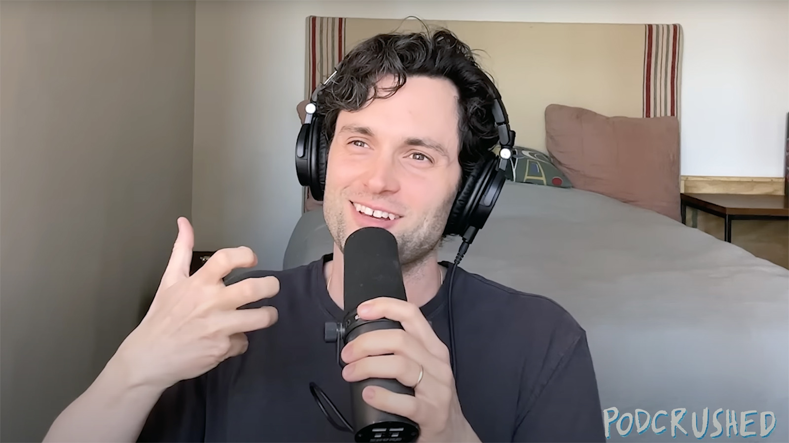 Penn Badgley records an episode of "Podcrushed." (Video screen grab)