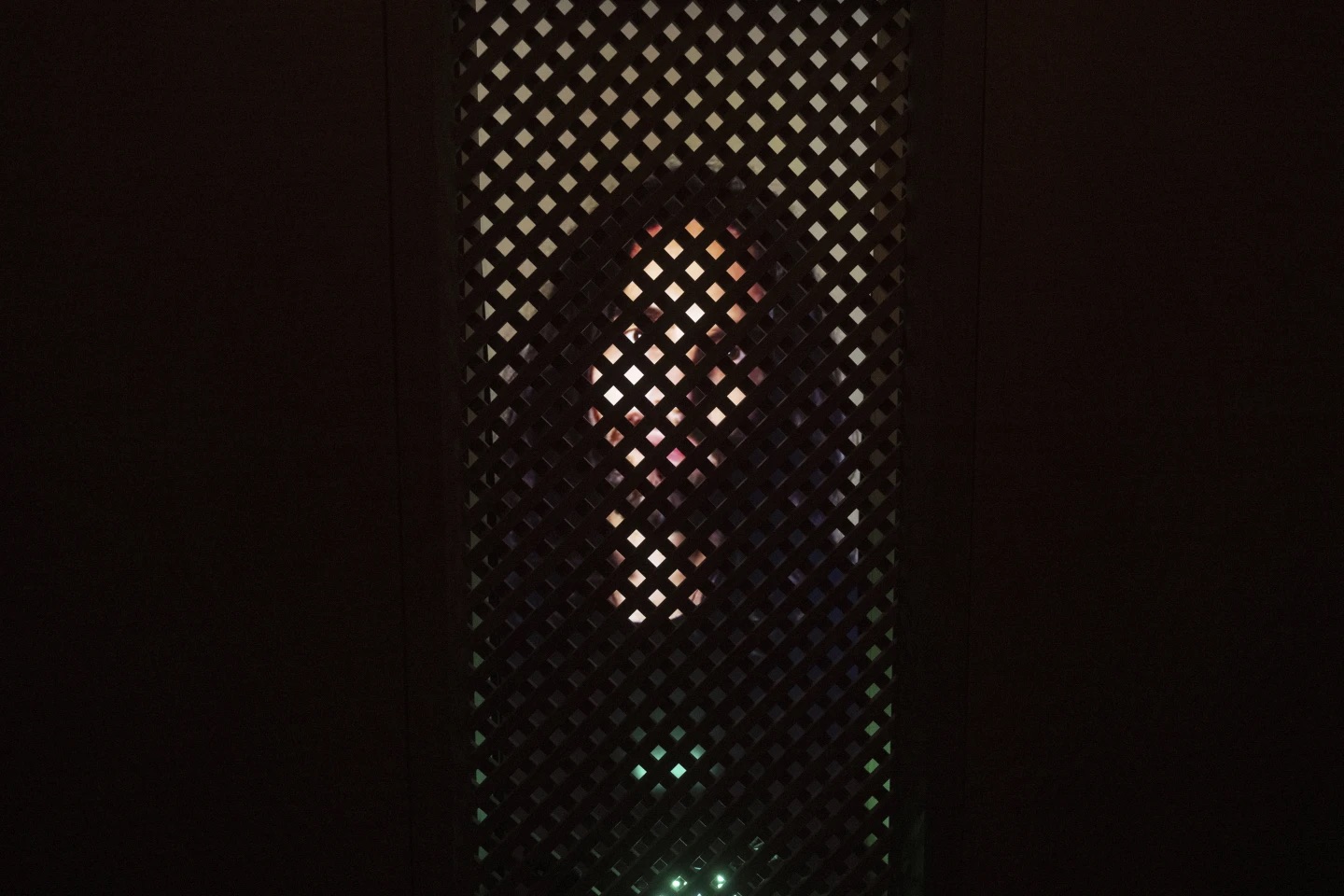 An experimental art installation with an AI Jesus entitled, Deus in Machina, installed in a confessional in St. Peter's Chapel