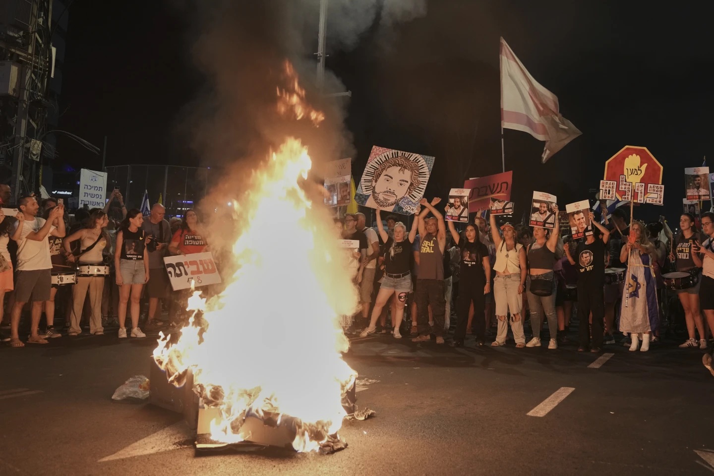 People take part in a protest demanding the end of the war