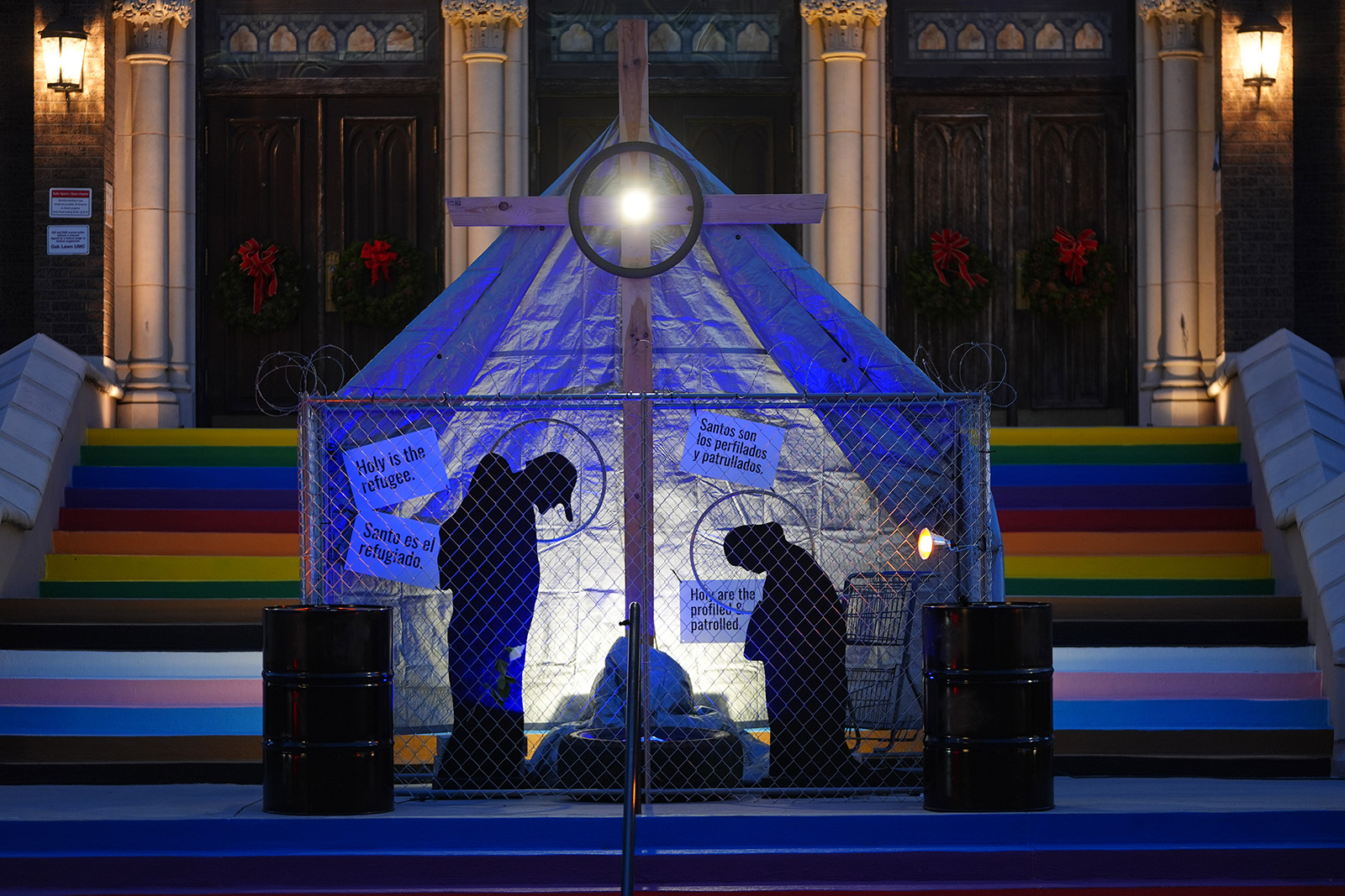 A Christmas Nativity scene portrayed as a U.S. Immigration and Customs Enforcement detention center sits on display in front of the Oak Lawn United Methodist Church, in Dallas, Dec. 15, 2025. (AP Photo/LM Otero)