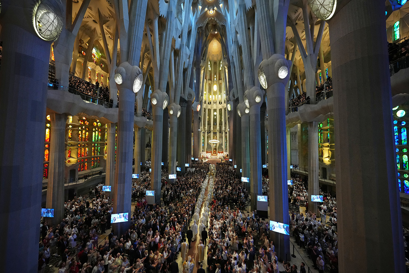 Pope Leo XIV, bottom, walks in procession to celebrate a Mass in the Basilica of the Sagrada Família in Barcelona, Spain, Wednesday, June 10, 2026. (AP Photo/Alessandra Tarantino)